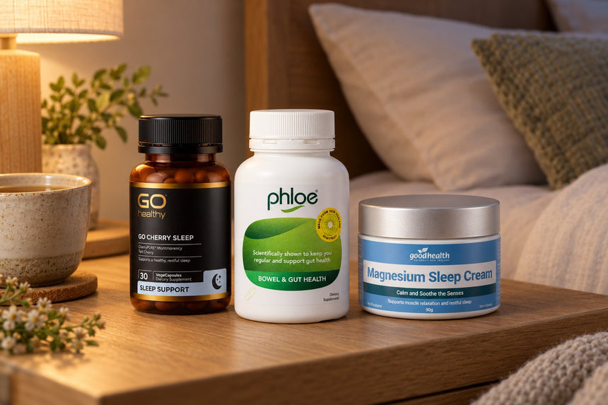 Phloe Capsules, GO Cherry Sleep and Good Health Magnesium Sleep Cream on a bedside table in evening lamplight